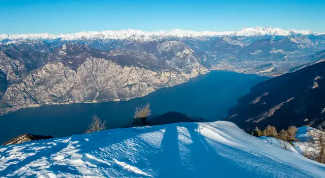 Snow capped mountains at Lake Garda during the winter.