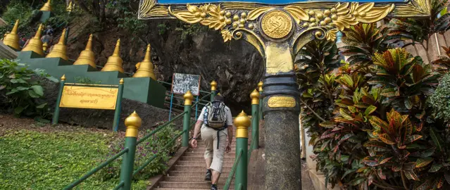 Climbing the first steps at the Tiger Cave Temple