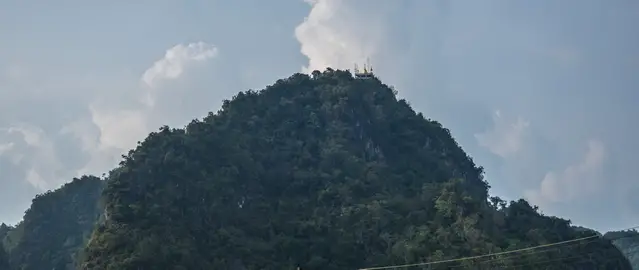 The summit of the Tiger Cave Temple from the distance
