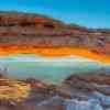 Mesa Arch with snow in winter at sunrise