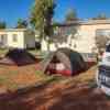 Campsite for two tents in Exmouth in Australia in fron of two cabins