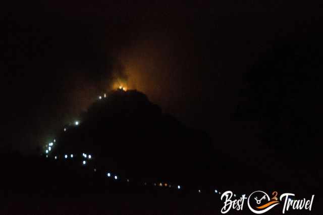 The path up to Adams Peak is lightened at night.