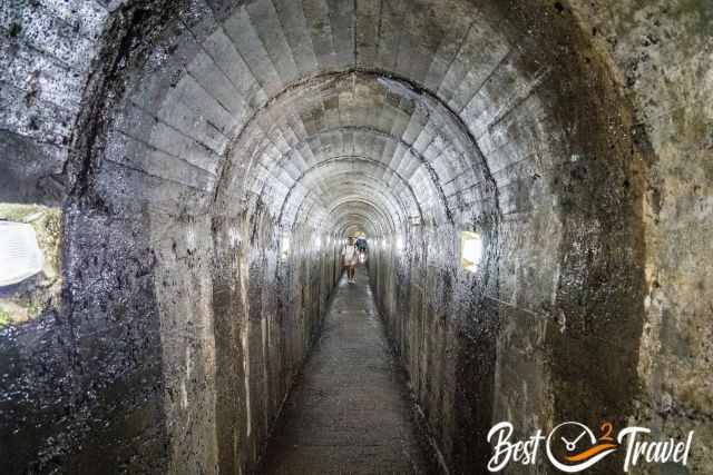 The long concrete tunnel like in a mine
