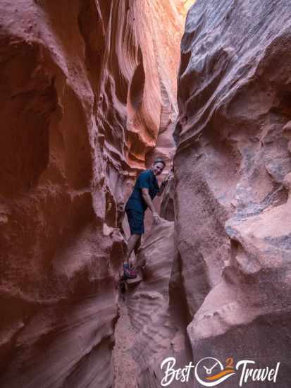 A hiker in a narrow slot canyon.