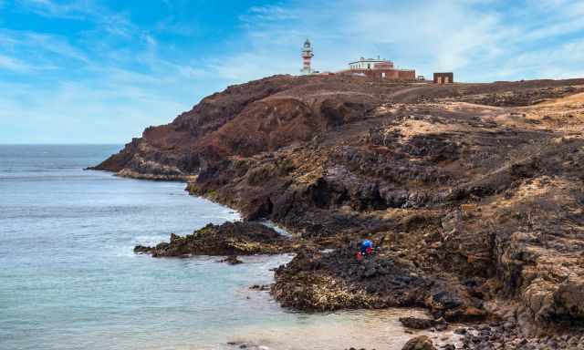 Arinaga Lighthouse and coast from the distance