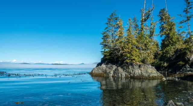 Sunny blue sky, the sea, and a small island