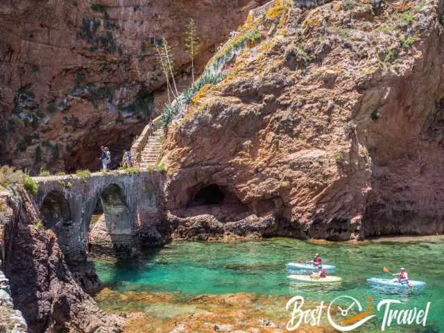 Kayaks passing by under the fortress bridge