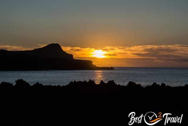 The sunset with outlines of the lava rocks