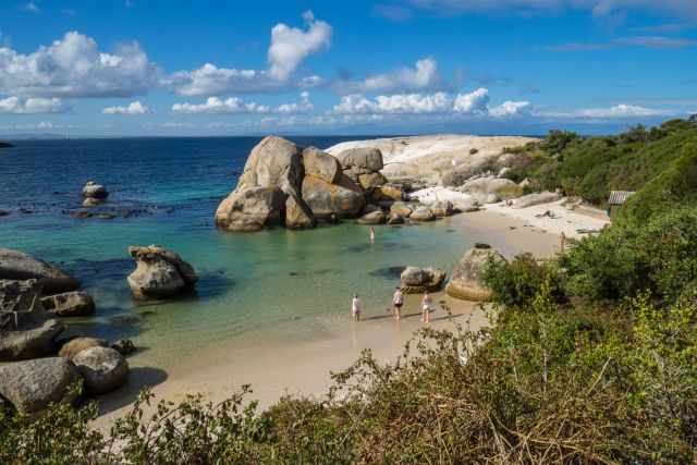 The real Boulders Beach where visitors swim, walk or sit on the beach towels.