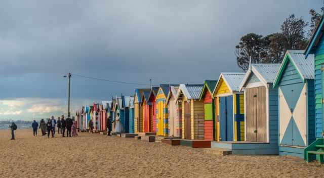 Brighton Bathing Boxes with a huge group in the back