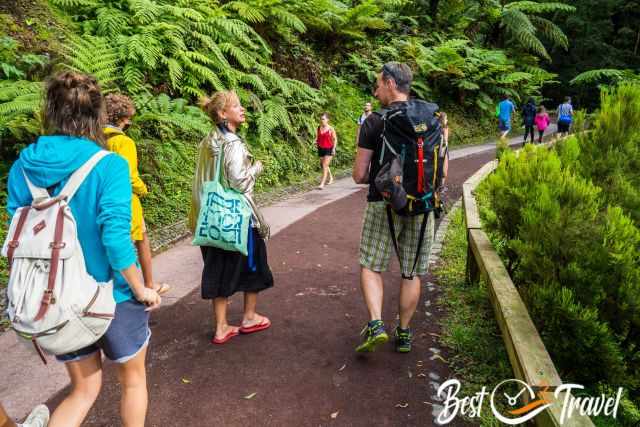 Visitor on the paved path to the pools.