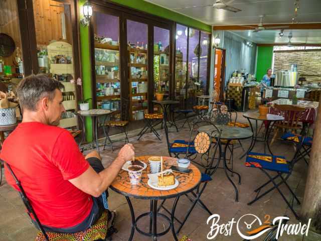 Visitors having a coffee and cake in the organic food store.