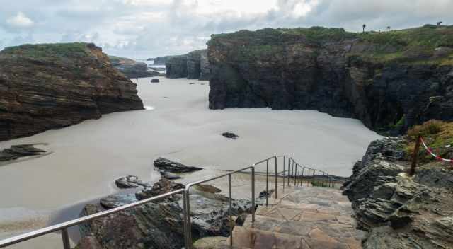 Staircase down to the beach at low tide