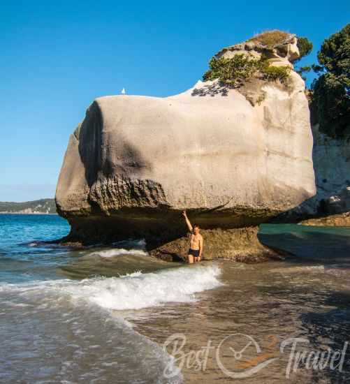 Mare Leg Cove and a visitor standing next to the rock