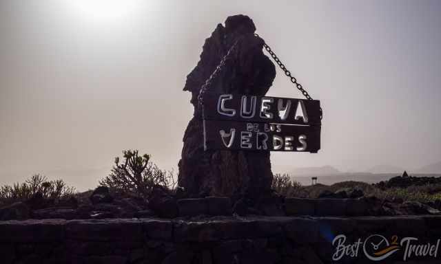 Entrance sign and gate to the cave