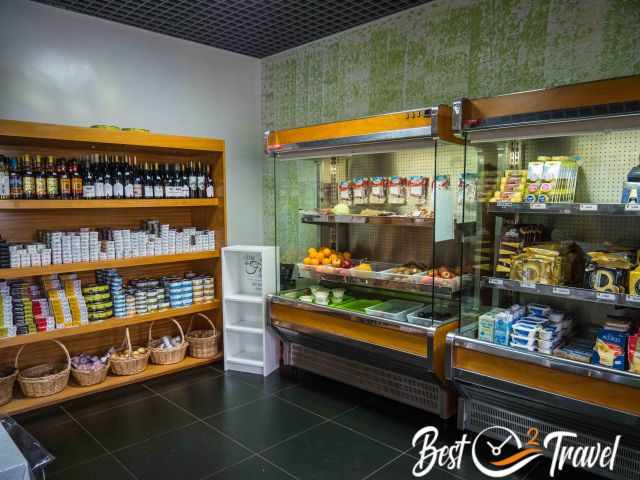 Several shelves filled with the famous cheese.