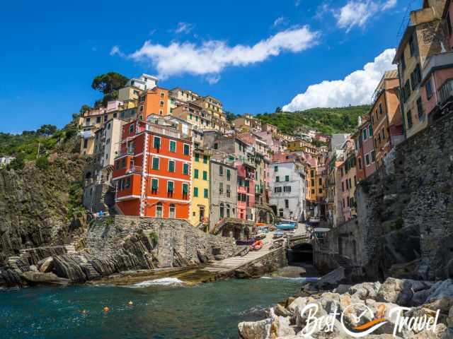 Riomaggiore and its small harbour on a sunny day.