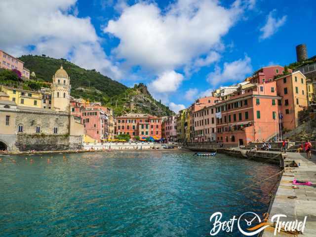 Vernazza harbour and beach full of visitors in the summer.
