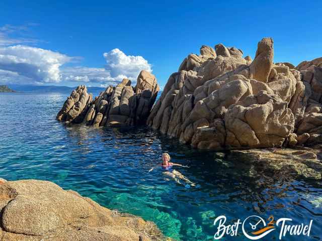 A woman swimming in a sheltered bay