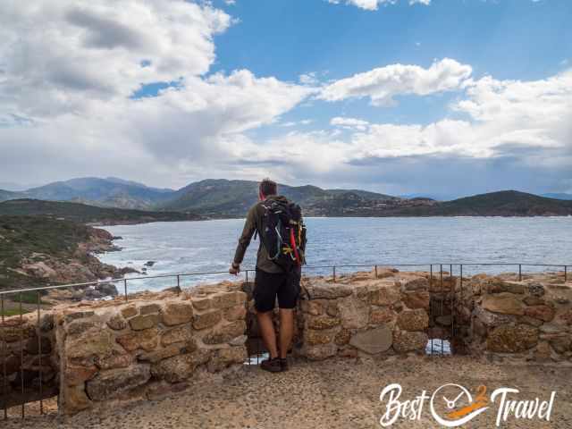 A hiker on top of the Genoise tower d'Omigna