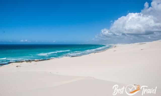 The breathtaking white dunes and the turquoise sea with a blue sky