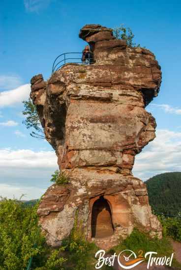 A female hiker on top of the rock Drachenfels