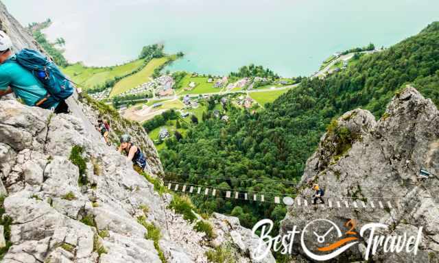 Several climbers at Dragon wall and on the suspension bridge