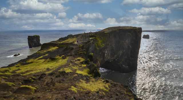 Walk to Dyrholaey rock arch close in front of it