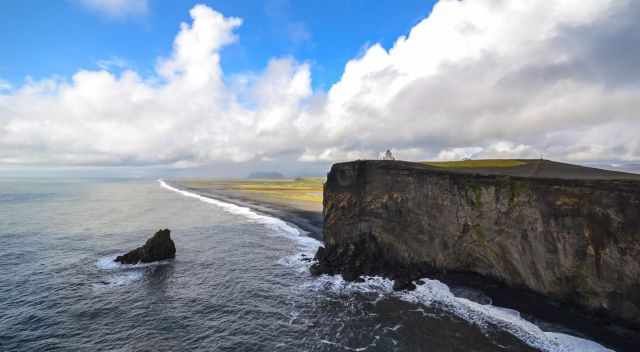 Dyrholaey coastline - black beach - lighthouse