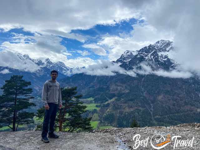 A visitor with the panoramic scenery in the back.