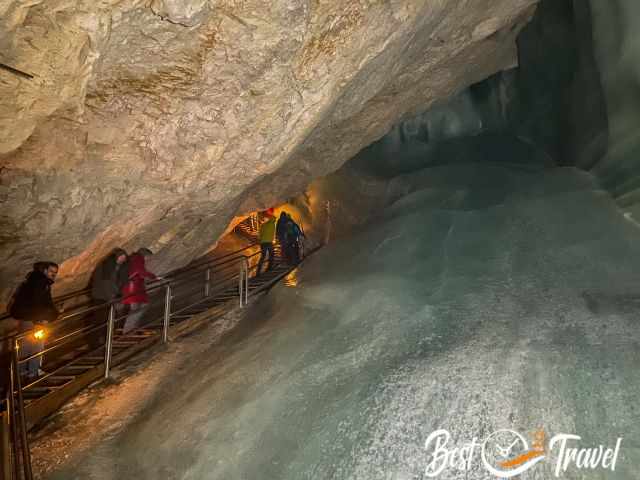 Visitors on the stairs left and to the right the massive ice wall.