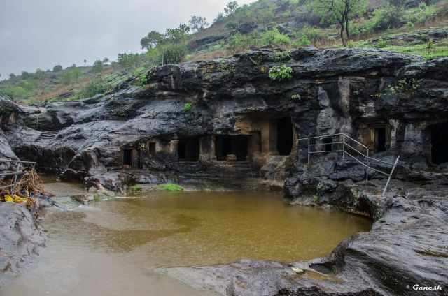 Ellora Caves with huge puddles and dripping rain