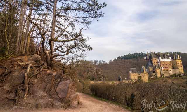 Climbing path left and Eltz Castle to the right