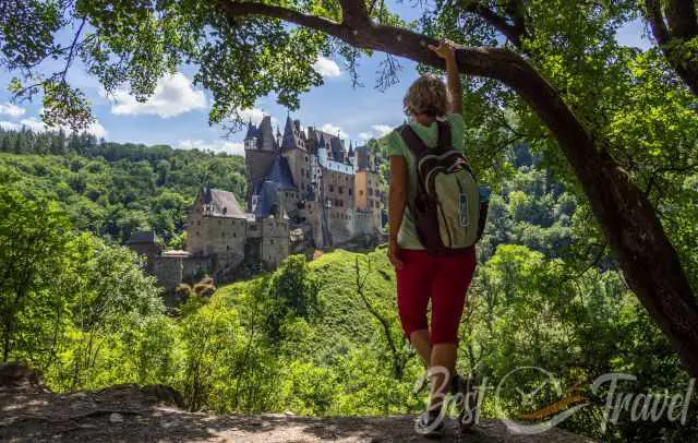 Me in the shadow of a tree looking to Eltz Castle