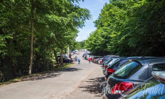 A long parking lot along the forest