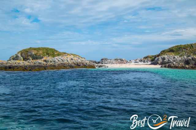 Turquoise shallows and a small beach on the Isle of Coll, reached during my cold‑water snorkel tour with seals.