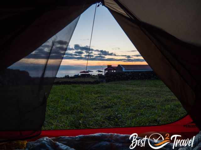 A sunset at the sea watched out of the tent.