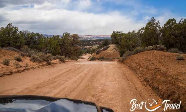 The red sandy and bumpy dirt road