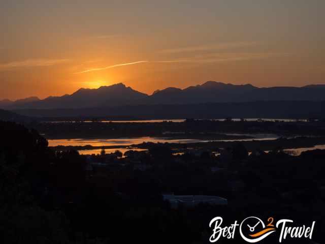 An orange sunset at the mountains.