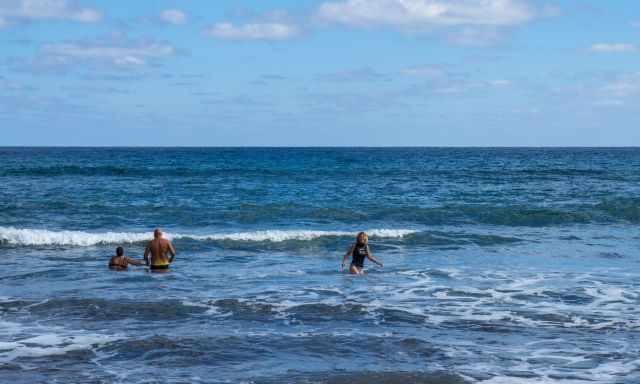 People swimming in the sea at Playa de Vargas