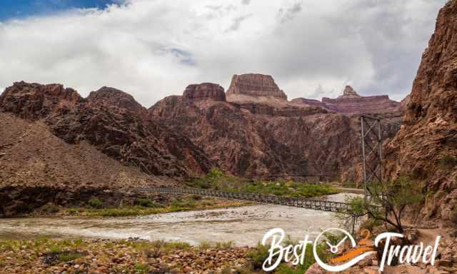 Silver Bridge and Colorado River and dark clouds at the sky