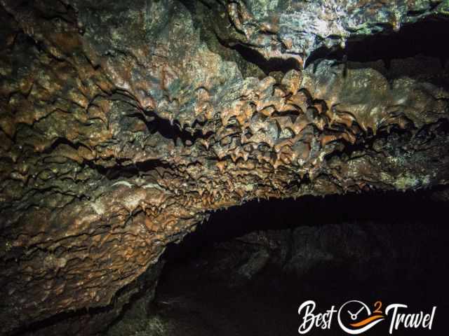 The ceiling of the cave in black and orange colour.
