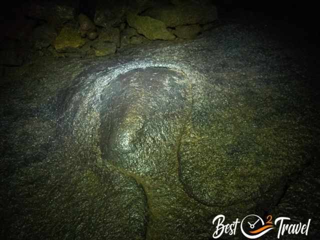 The cave floor and a stone free of lava