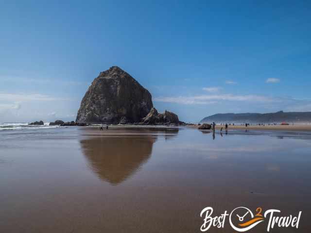 Cannon Beach and Haystack Rock and plenty of visitors.