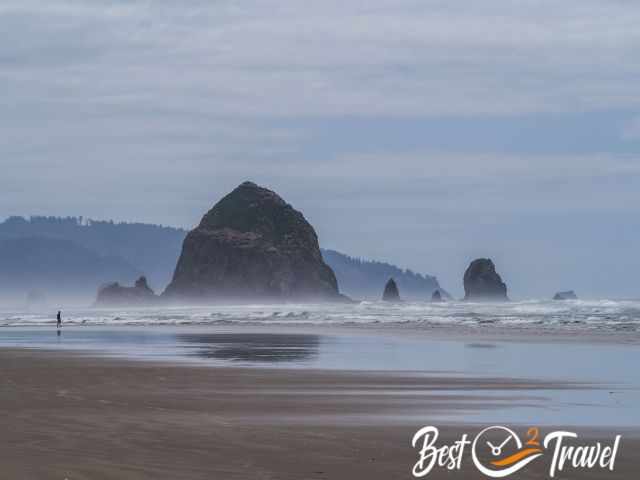 Haystack Rock and Cannon Beach was empty before low tide.