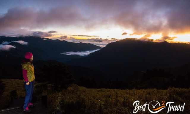 A woman on the staircase path to the summit of Hehuanshan