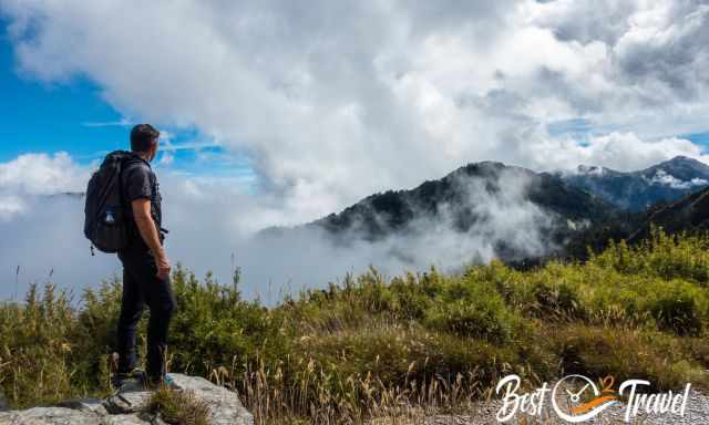 A hiker above the clouds on Hehuanshan Mountain