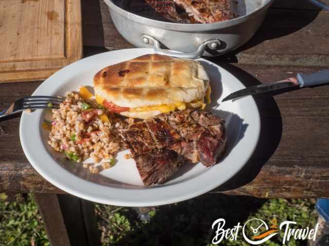 A plate filled with food from the braai.