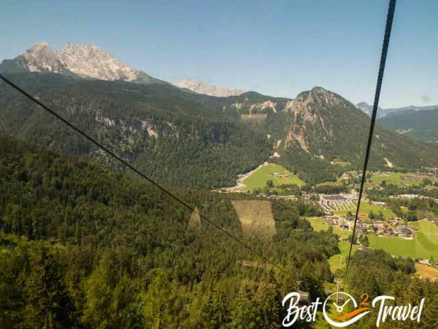 View out of the cable car to Watzmann, the parking and Schönau at Lake Königssee.