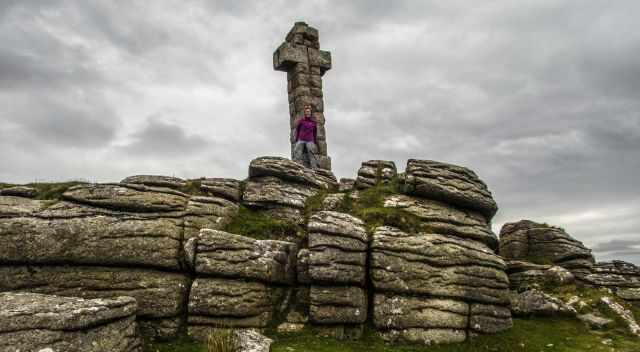 A woman in front of the Widgery Cross